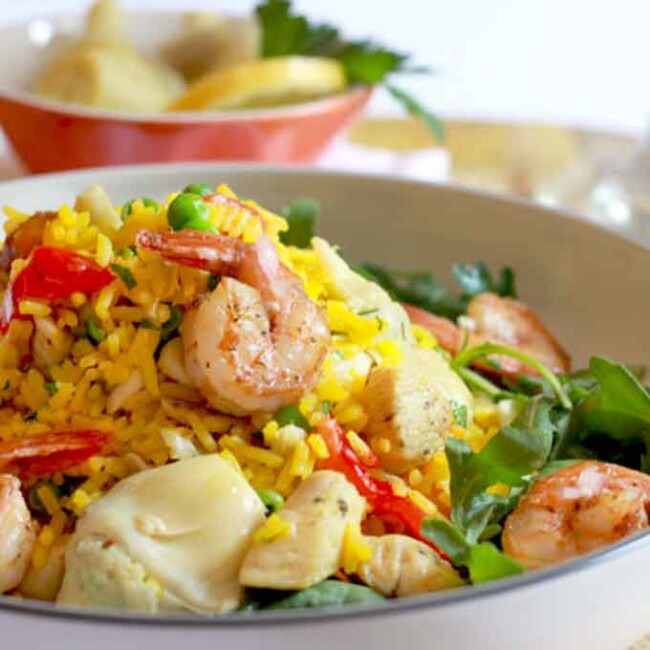 Shrimp and chicken paella salad served in a bowl.