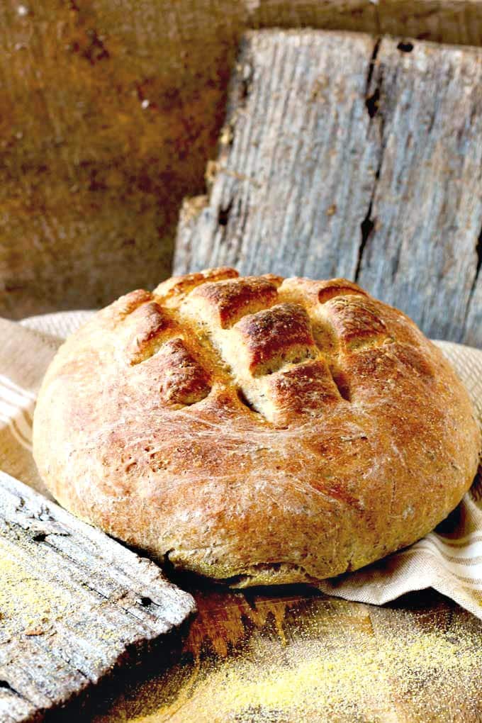 A loaf of Bauernbrot on a wooden surface.