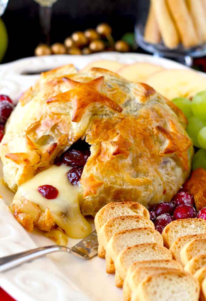 Baked Brie with Cranberries appetizer served on a white platter
