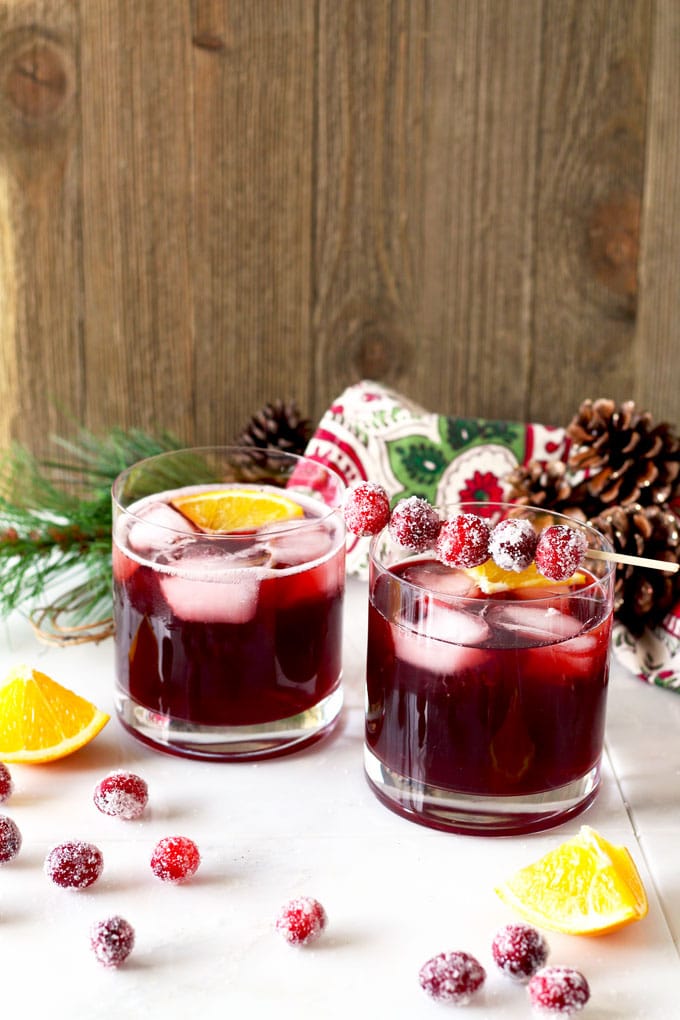 The right balance of sweet and tart, with the warmth of bourbon and subtle orange tones. This Cranberry Maple Bourbon Cocktail is bright, delicious, and perfect for the holiday season!