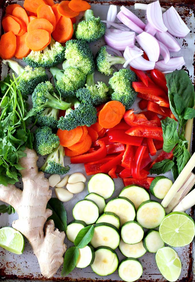 Vegetables, aromatics and fresh herbs needed to make Thai curry