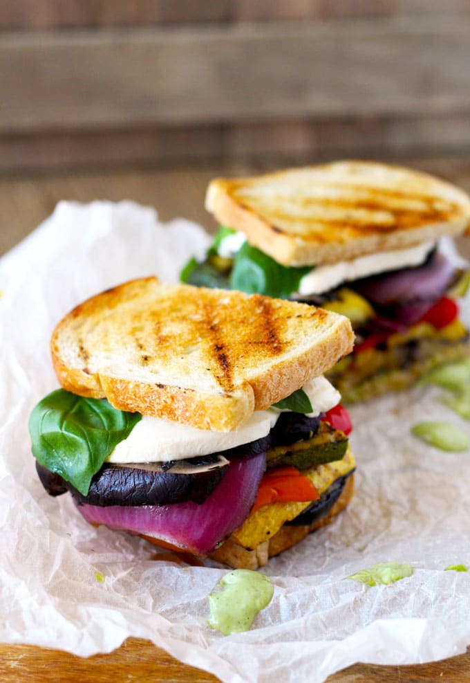 Side shot of two Grilled Veggie Sandwiches. 