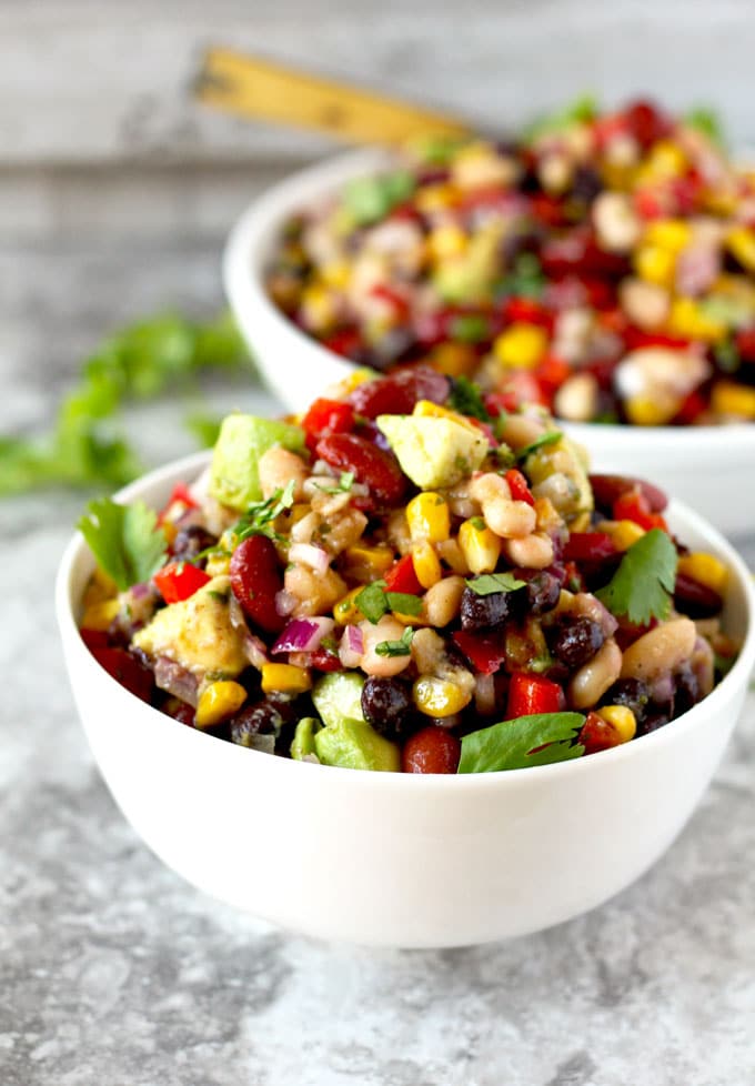 A serving of Mexican Three Bean Salad recipe in a white bowl.