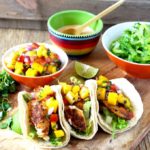 Full flavored and easy to make Blackened Fish Tacos with Mango Salsa and Sriracha Aioli. Fish fillets coated in a Cajun inspired spice mix served in warm tortillas and topped with a fresh and tasty mango salsa. Finish it up with a drizzle of creamy and spicy sriracha aioli for the best tacos ever!!!