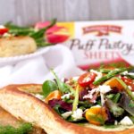 This perfectly golden brown and flaky Puff Pastry Tart with Tomatoes, Asparagus and Herbed Feta is delicious, easy to make and perfect served as an appetizer or lunch.