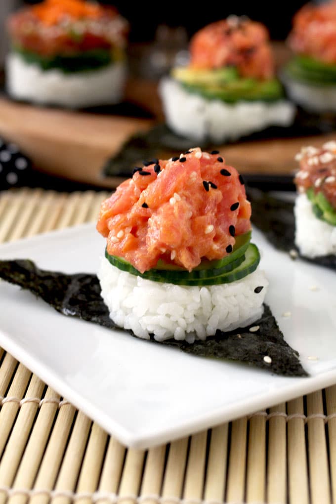 These easy to make, delicious and super flavorful sushi stacks are made with fresh tuna, sushi rice, cucumbers and avocado. Included in the recipe 2 different tuna preparations! Spicy Sriracha Tuna and Soy Sesame Lime. The perfect little bites to satisfy your sushi cravings.