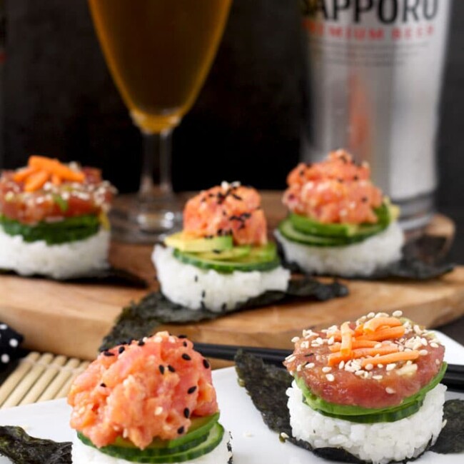 These easy to make, delicious and super flavorful sushi stacks are made with fresh tuna, sushi rice, cucumbers and avocado. Included in the recipe 2 different tuna preparations! Spicy Sriracha Tuna and Soy Sesame Lime. The perfect little bites to satisfy your sushi cravings.