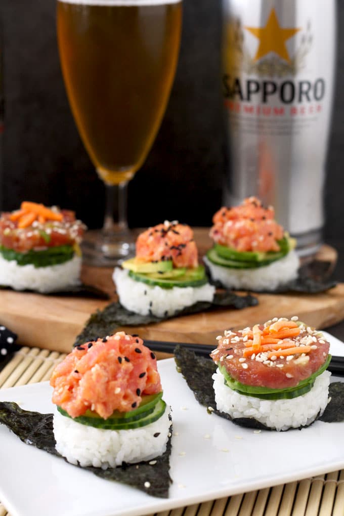 These easy to make, delicious and super flavorful sushi stacks are made with fresh tuna, sushi rice, cucumbers and avocado. Included in the recipe 2 different tuna preparations! Spicy Sriracha Tuna and Soy Sesame Lime. The perfect little bites to satisfy your sushi cravings.