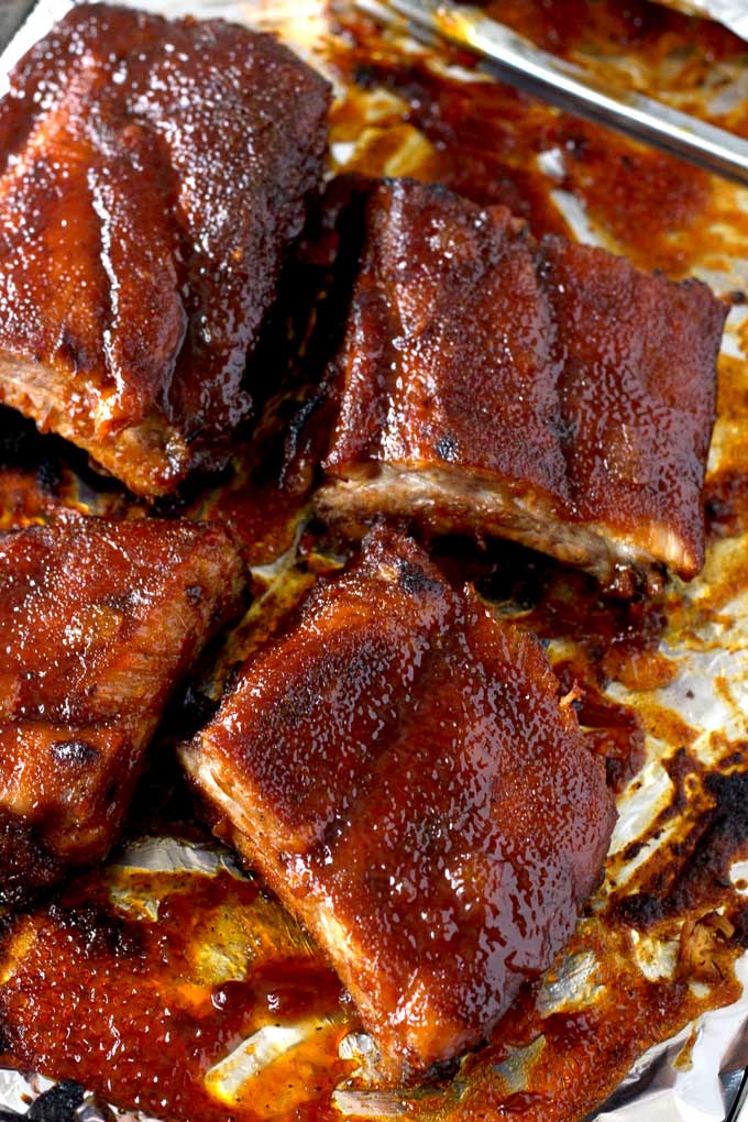 Baby Back Ribs cut into smaller pieces on a baking pan