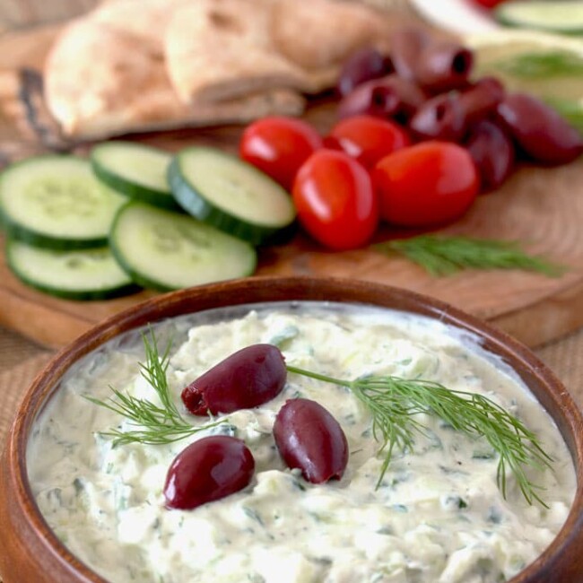Greek Tzatziki Sauce is made from just a few ingredients. Fresh cucumbers and Greek yogurt are the base of this fresh, light and healthy sauce. Perfect as a dip, condiment or as an accompaniment to many Mediterranean dishes.