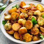 Golden skillet potatoes on a plate