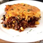 This Tamale Pie is loaded with tasty and hearty ground beef chili that seeps through a delicious homemade brown butter cornbread topping. This easy tamale pie recipe is cooked in one skillet and is bursting with layers of flavor!