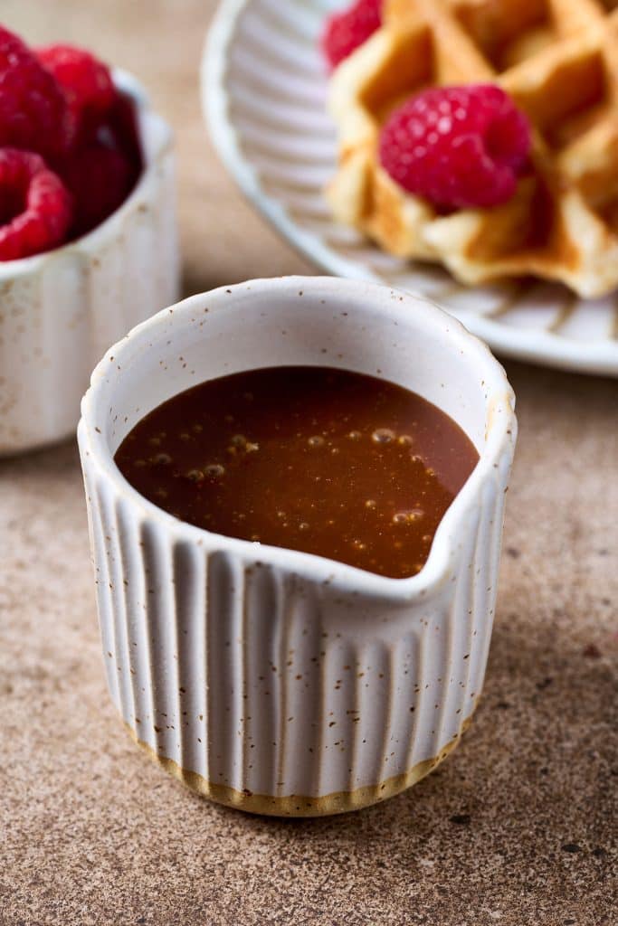 salted caramel sauce on a small white container