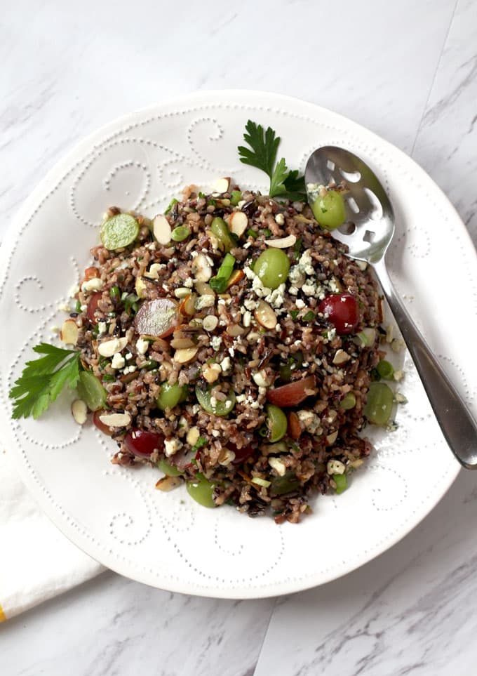 Overview of Wild Rice Salad with Miso Vinaigrette with grapes, almonds and blue cheese.