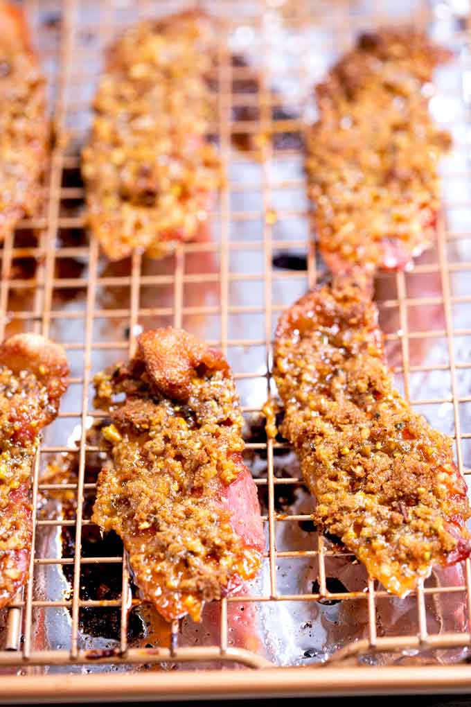 Crispy golden brown bacon (pig candy) on a baking rack.