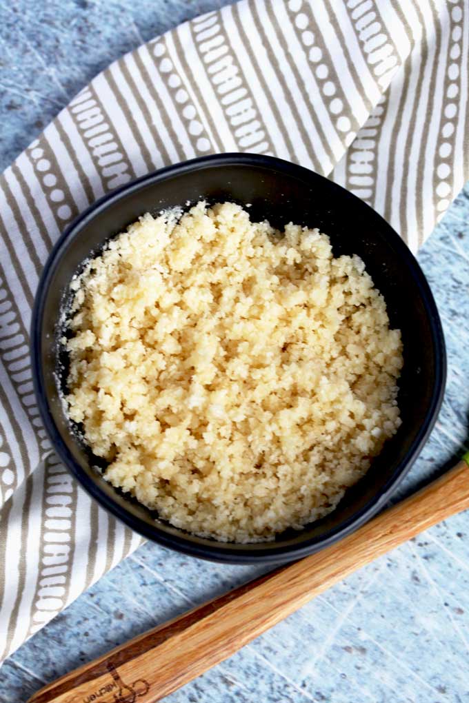 Panko Bread Crumbs, Parmesan cheese and melted butter mixed in a small bowl.