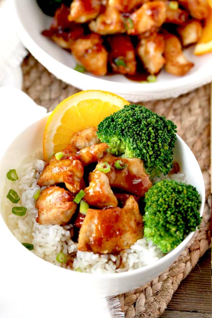 Chinese Chicken with Orange Glaze served in a bowl over white rice 