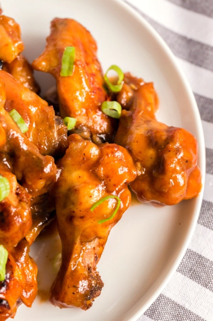 Plate filled with slow cooker honey bbq wings