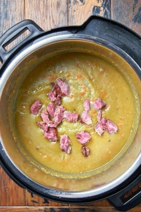 creamy split pea soup with shredded ham pieces on top