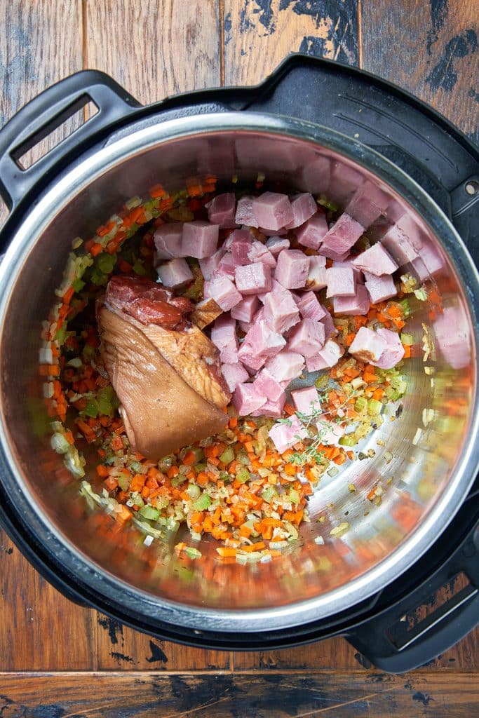 Veggies, ham bone and hame cubes in an instant pot
