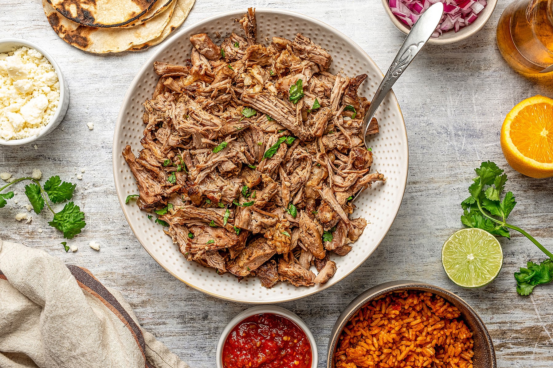 Close up view of the shredded pork carnitas showing the golden brown crispy edges