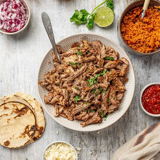 top view of a bowl containing slow-cooked carnitas