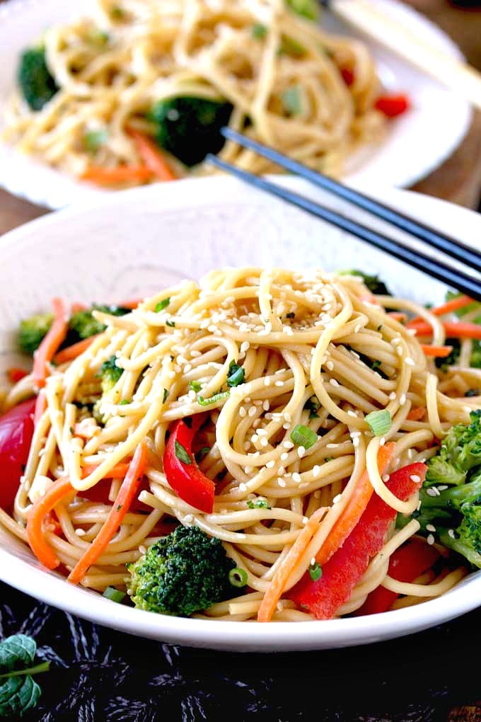 A bowl filled with Sesame Noodles with veggies.