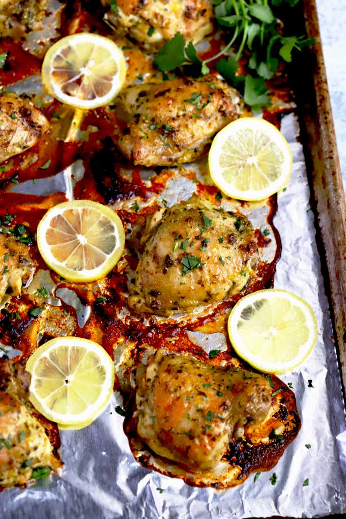 Roasted Chicken Thighs on a baking sheet pan.