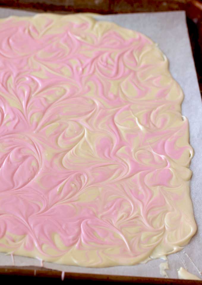 White chocolate layer with a pink marbled topping
