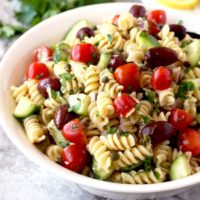 Close up view of Pasta Salad served in a white bowl