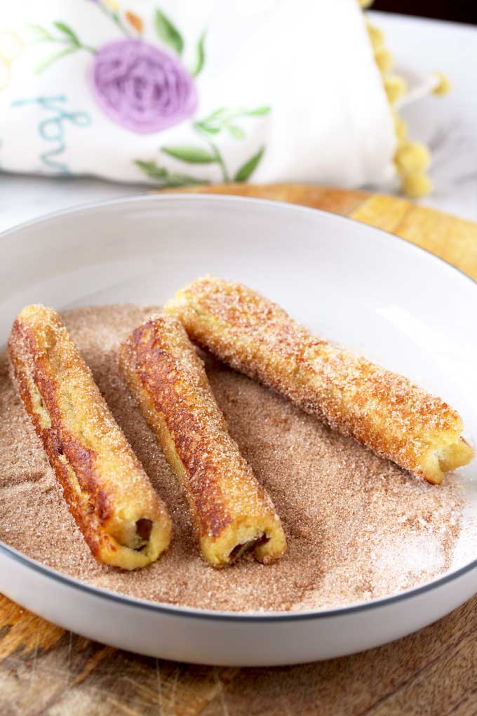 Nutella French Toast Roll-Ups are rolled in cinnamon sugar
