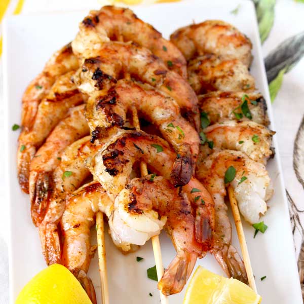 These Grilled Shrimp Skewers are seasoned with a simple Cajun butter resulting in the most mouthwatering, succulent and delicious grilled shrimp. An easy appetizer or dinner recipe guaranteed to become a favorite!