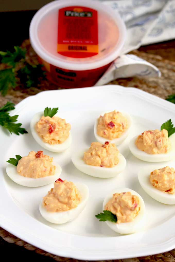 Pimento Cheese Deviled Eggs on a white platter