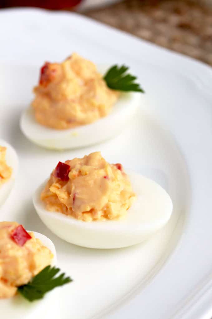 Pimento Cheese Deviled Eggs served on a white plate