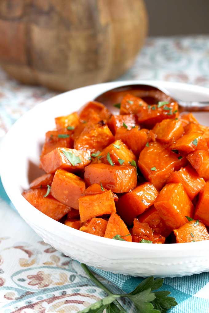 A white bowl filled with Maple Oven Roasted Sweet Potatoes