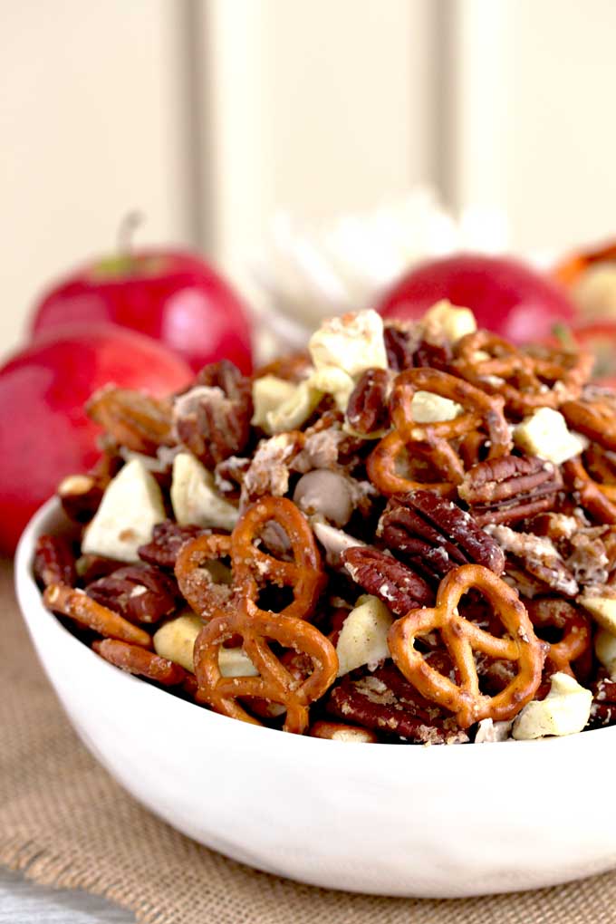 Apple Pie Party Mix in a small white bowl.