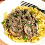 Stroganoff made with hamburger meat on top of noodles.