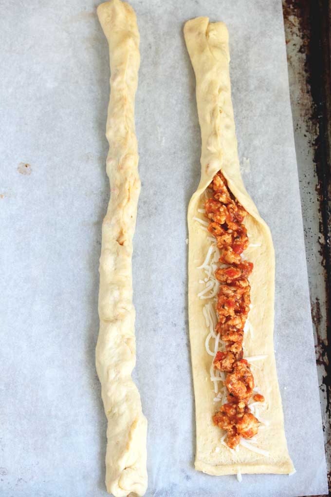 Crescent dough strips filled with cheese and ground turkey filling.