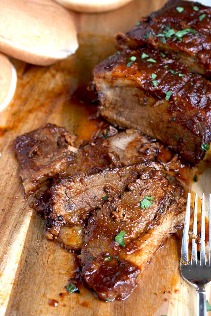 Beef Brisket slices on a cutting board.