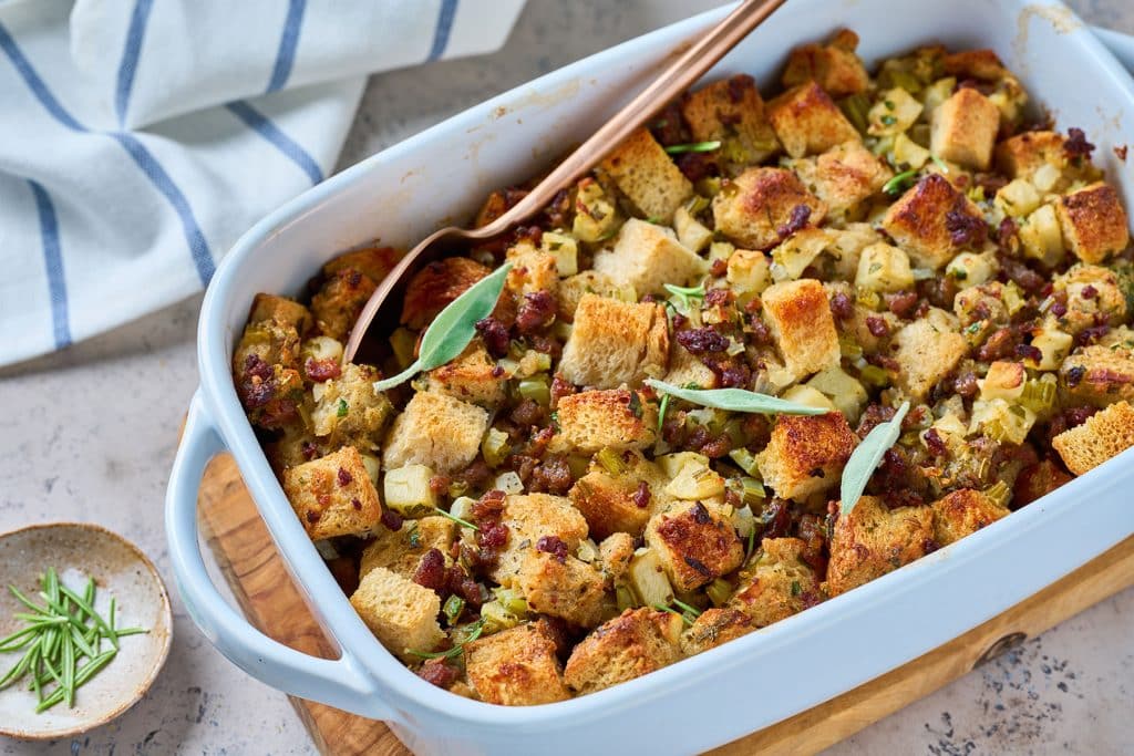 Golden brown sausage stuffing in a casserole dish