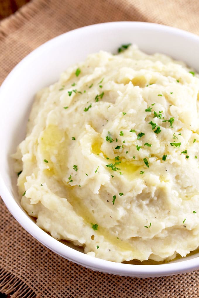 Creamy Instant Pot Mashed Potatoes in a white bowl.