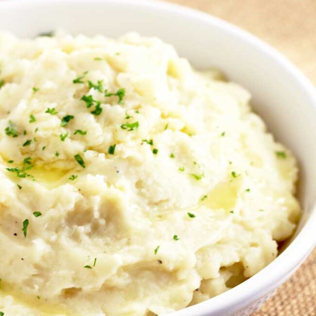 Instant Pot Mashed Potatoes served in a white bowl.