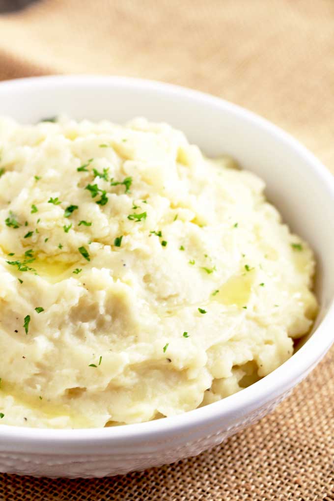 Instant Pot Mashed Potatoes served in a white bowl.