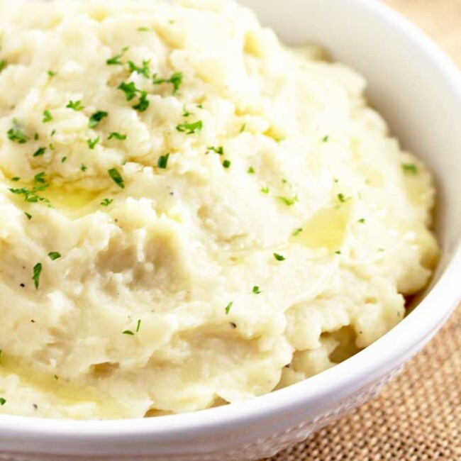Creamy Instant Pot Mashed Potatoes in a white bowl.
