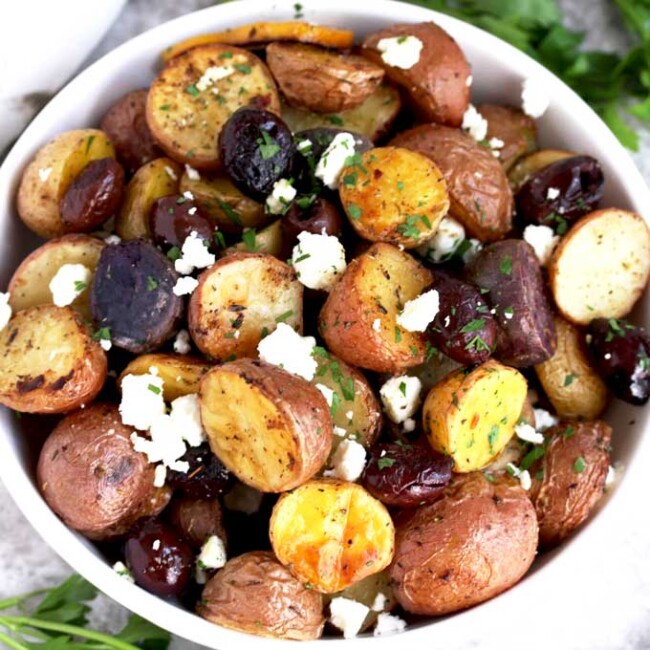 Roasted Greek Potatoes served in a white bowl.