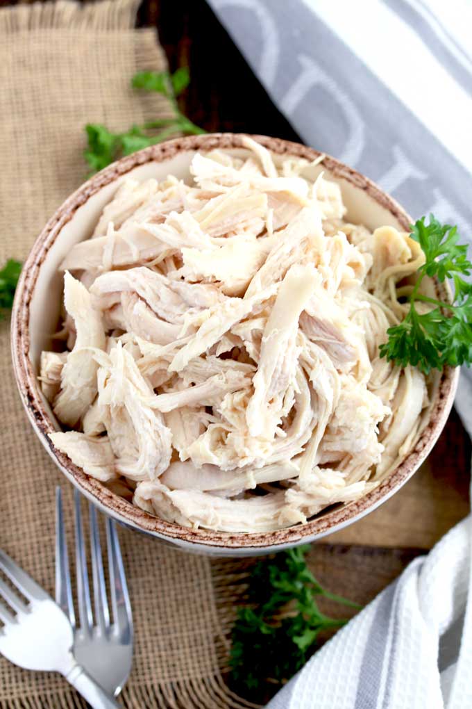 Shredded chicken made in the instant pot in a bowl.