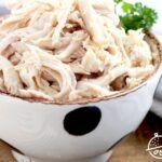 Pin image of shredded chicken breast in a bowl