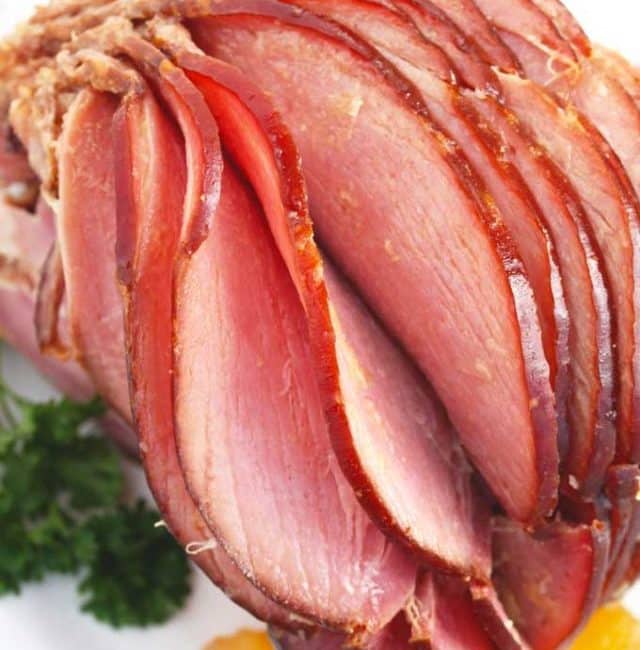 Sliced Slow Cooker Spiral Ham on a white platter