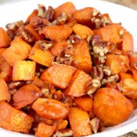 Candied Sweet Potatoes on a white serving bowl