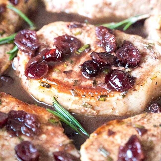 Pork Chops with Port and cranberries on a skillet